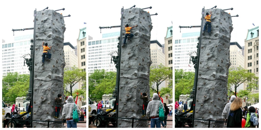 Boy climbing rock wall at the Chase 500 Festival Kids' Day