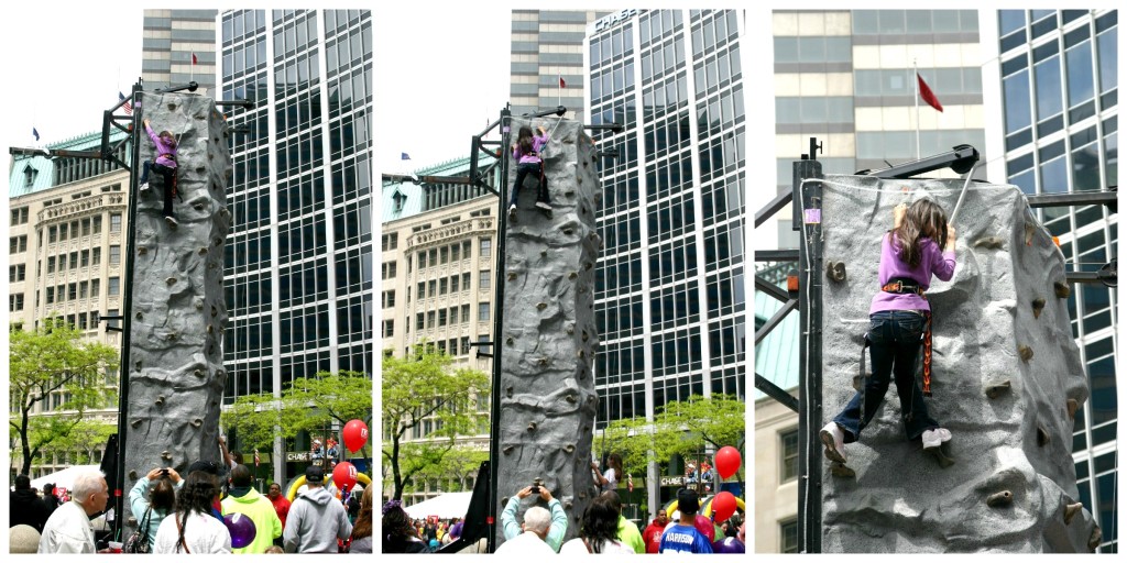 Girl climbing rock wall at the Chase 500 Festival Kids' Day