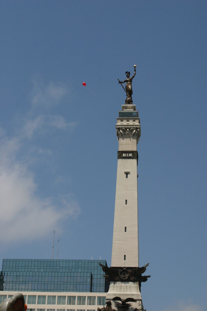 Monument with red balloon floating by at Chase 500 Festival Kids' Day