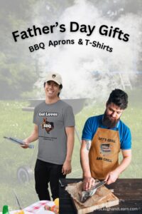 Two men wearing Father’s Day BBQ gifts—a “God Loves BBQ” t-shirt and a “Let’s Grill and Chill” apron—while grilling outdoors.