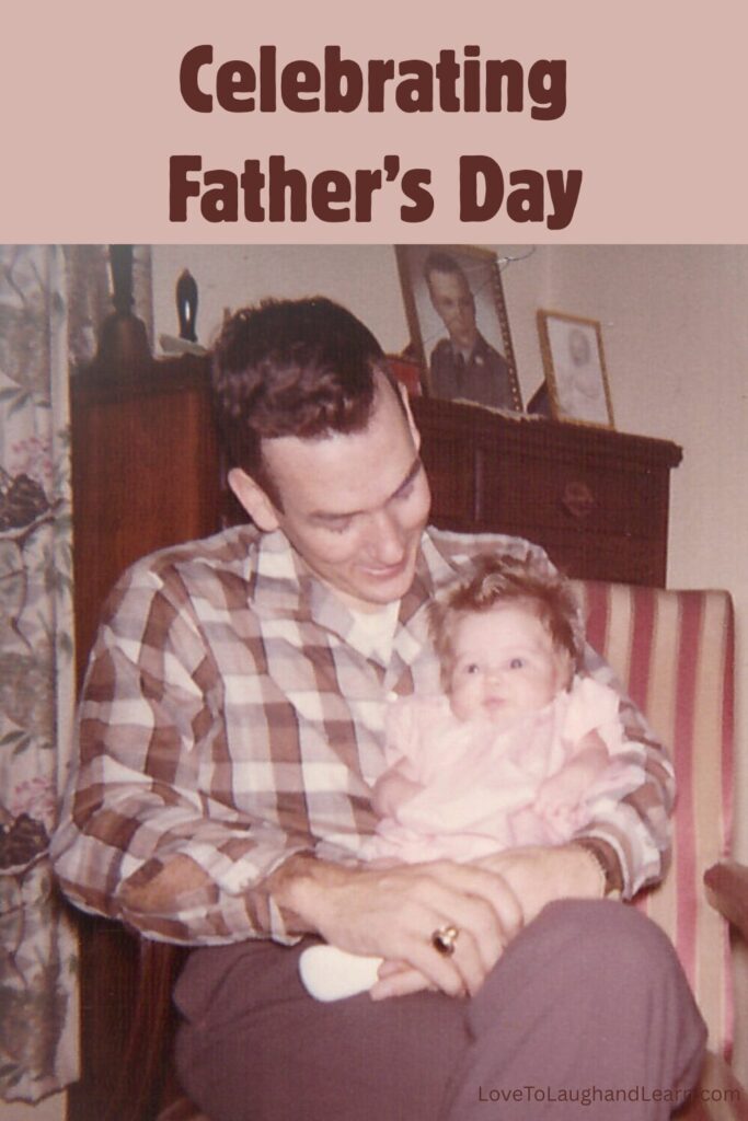Vintage photo of a smiling father holding his infant daughter on his lap in a striped chair, used in a Father's Day blog post celebrating dads and special memories.